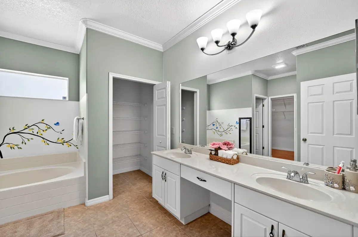 Primary bathroom with a garden tub and double vanity
