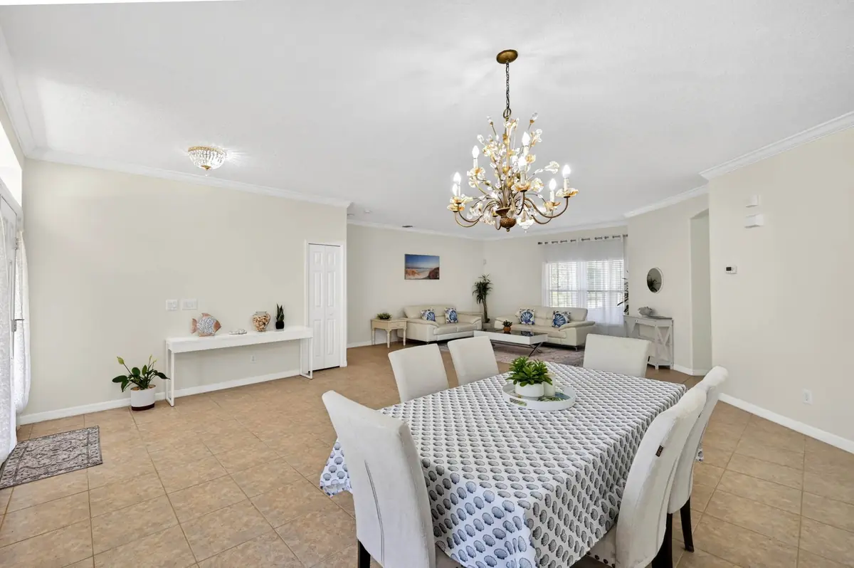 Dining room with a chandelier and a table set for six