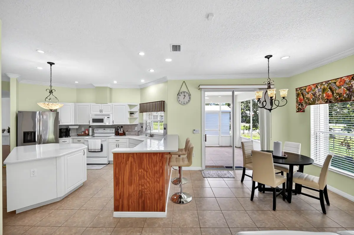 Kitchen island and a breakfast table beside the patio door
