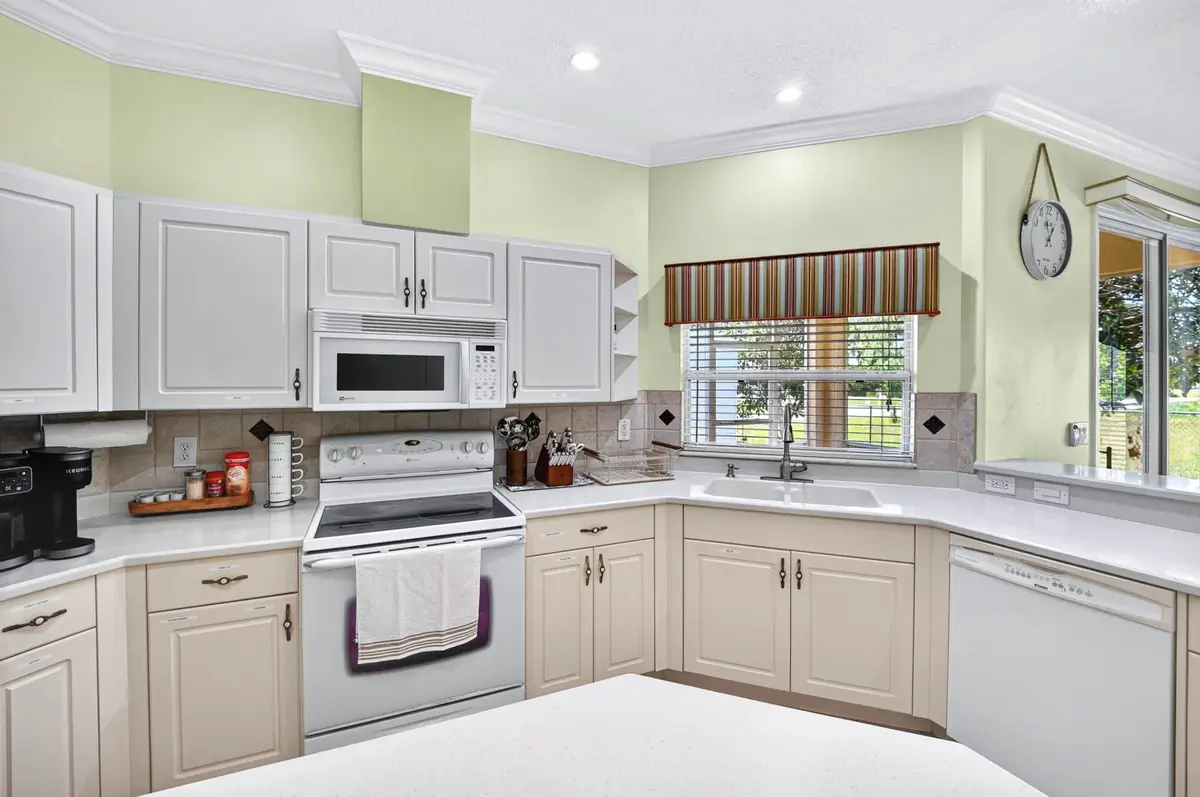 Kitchen counter with a double sink, range and microwave